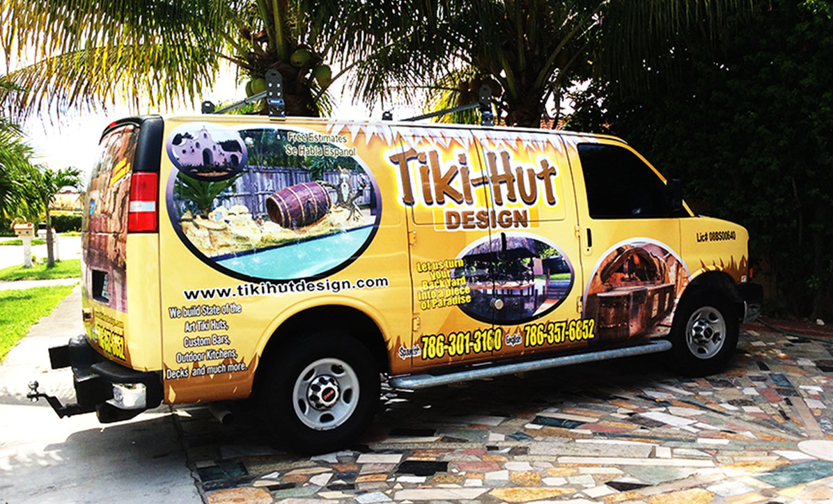 A yellow van with the words " tiki hut design ".